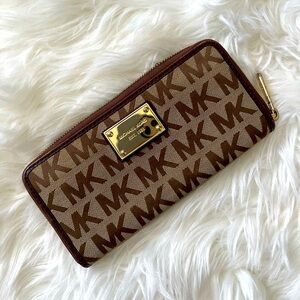 Michael Kors Brown and tan signature wallet.